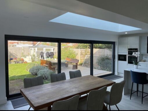 adversane-IMG_9663-optimized Modern open-plan dining area with skylight and sliding doors – part of a completed extension and renovation project near Worthing.