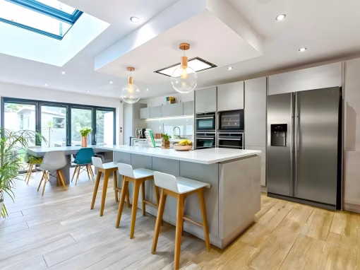 bg-hero-5 Luxury kitchen design with skylights, wood flooring and island seating.