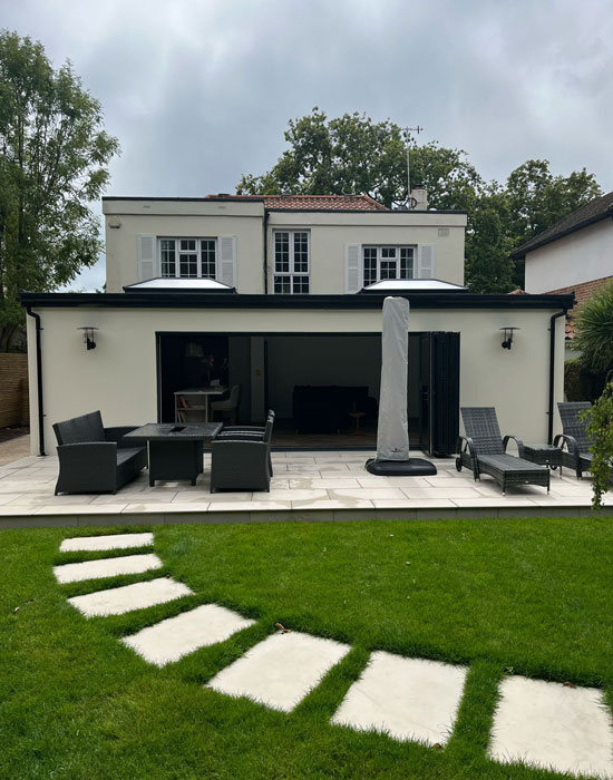 img-extensions-550-700 Double-storey rear extension with patio and garden path in Worthing.