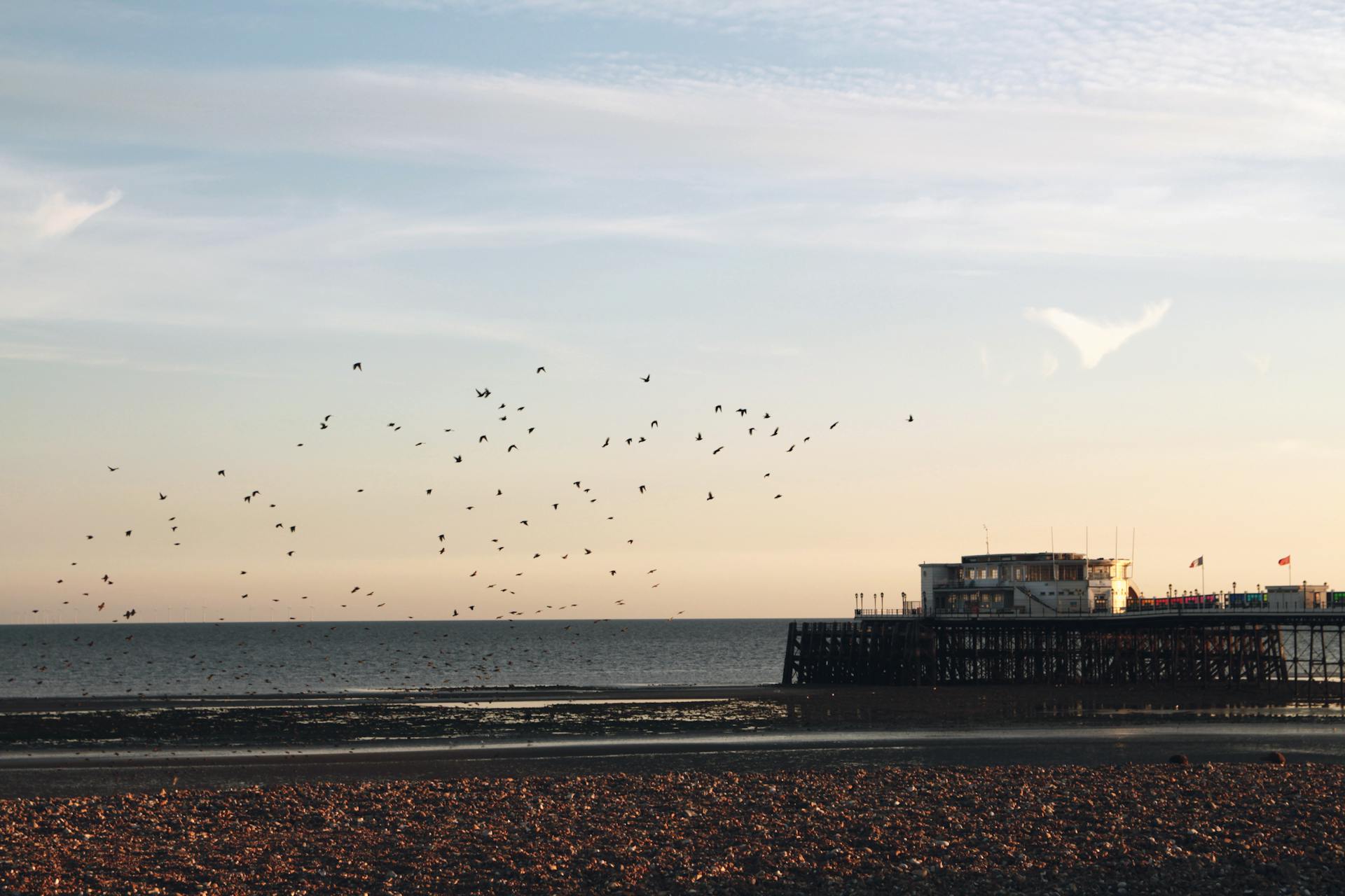 worthing Seafront view of Worthing beach at sunset, showcasing the iconic British seaside charm and tranquil coastal lifestyle.
