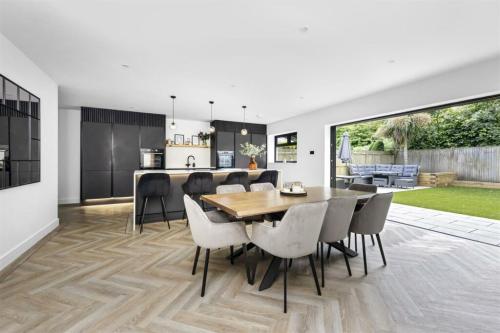 Open-plan kitchen and dining area with parquet flooring, part of a full renovation project in Aldsworth.
