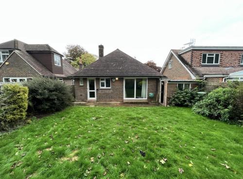 Rear exterior of bungalow in Aldsworth before house renovation and extension work began.