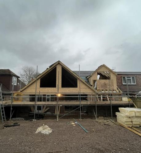 Framing stage of loft conversion and extension in Aldsworth during major property renovation by Force One Homes.