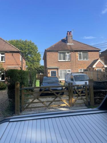 Front view of semi-detached property on Fenns Lane, Worthing, showing gated driveway and original exterior.