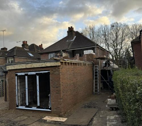 Midway through rear home extension in Fenns Lane – roofline and exterior brickwork taking shape.