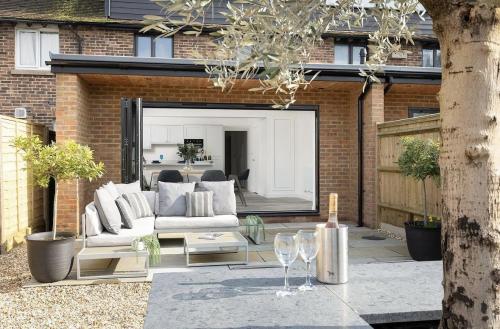 Modern rear extension on Fitzalan Road with open-plan living, bi-fold doors, and landscaped garden patio.