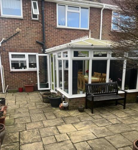 Original conservatory at rear of Nelson Road property before home extension and layout transformation began.