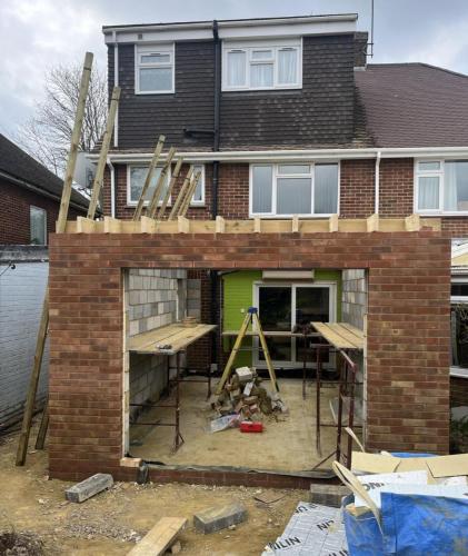 Rear extension under construction in Nelson Road, Worthing – brickwork and structural opening framed for new kitchen area.