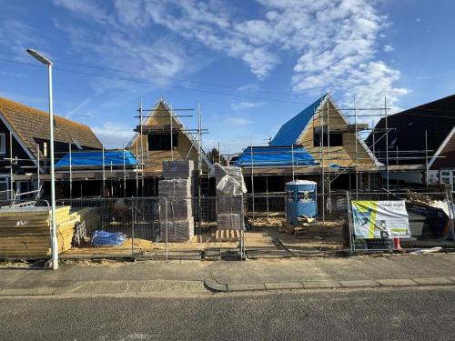 Timber framework and structural roofing on new build homes in North Avenue, Worthing, as part of residential construction.