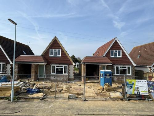 Ongoing house building project on North Avenue, Worthing, showing multiple detached new builds with scaffolding.