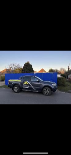 Force One Homes vehicle parked in front of hoarding at Ocean Drive building site in Worthing.