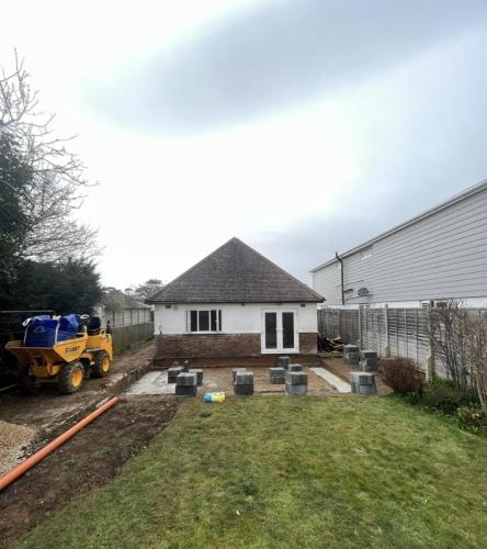 Groundwork and paving preparation in rear garden of Ocean Drive property prior to extension construction.
