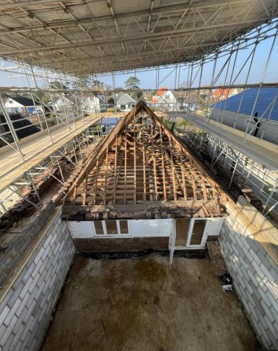 Loft stripped back to rafters for full roof rebuild at Ocean Drive home renovation in Worthing.