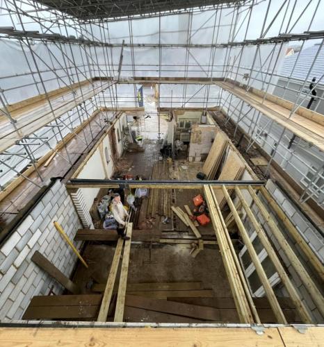 Scaffolded loft conversion and structural timber framing in progress at Ocean Drive renovation project, Worthing.