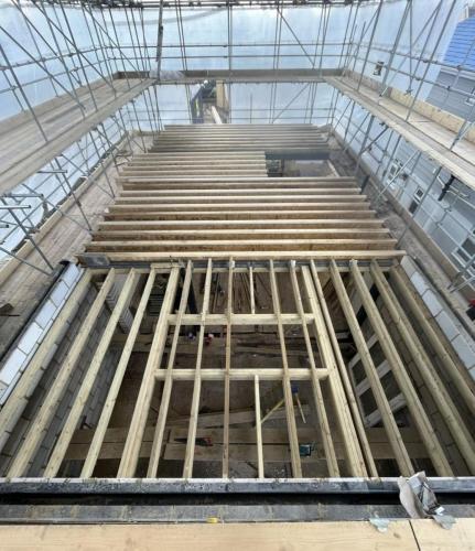 Timber joists and internal framing during upper floor loft extension at Ocean Drive property in Worthing.